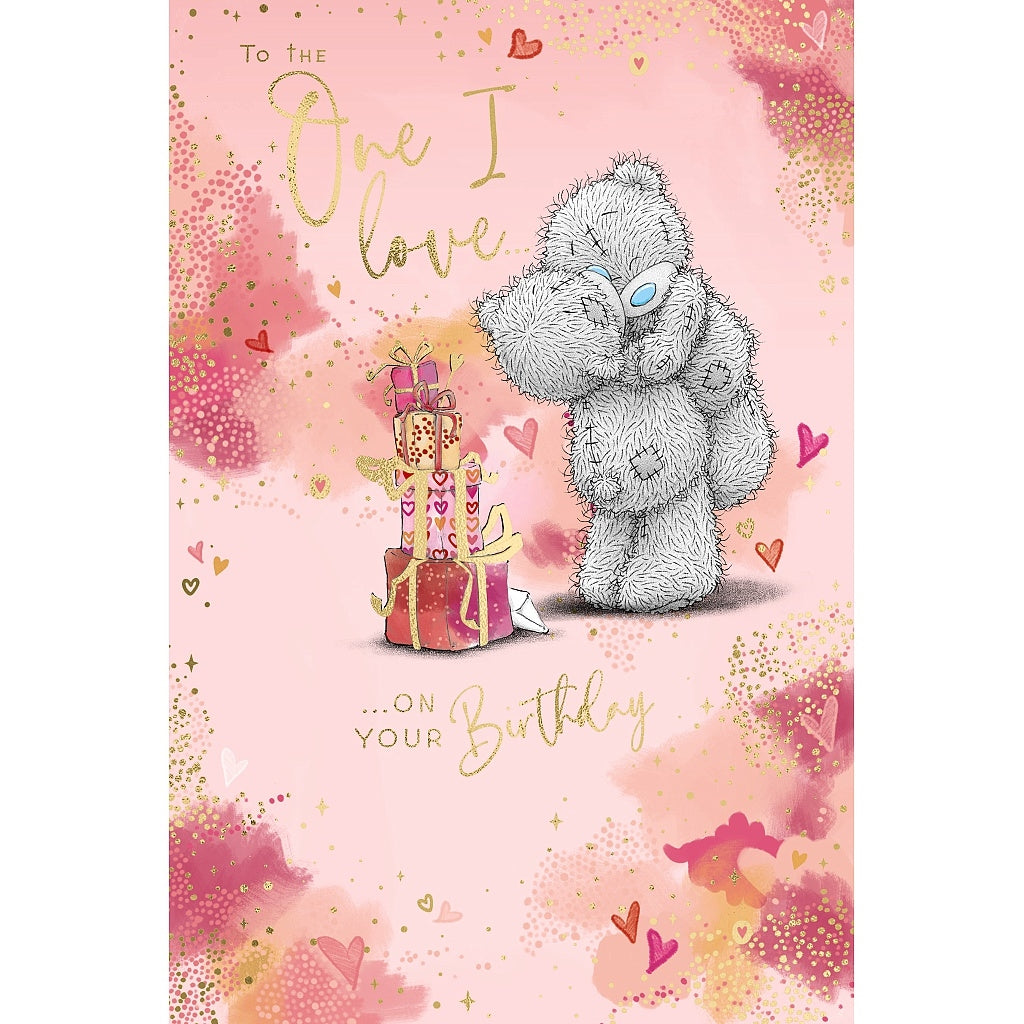 Greeting card with a teddy bear and birthday cake on a pink background
